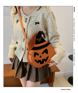 Detail of orange pumpkin crossbody bag with black wizard hat for Halloween costume