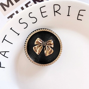 Retro black round folding phone grip with vintage gold 3D bow and beaded gold trim