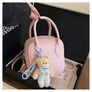 Pink square handbag with lychee texture leather and a cute blue bear charm in a gift box