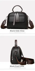 Close-up of black lychee grain leather handbag with brown strap and metal zipper