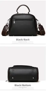 Detail of black pebbled leather handbag featuring back zipper and protective bottom studs