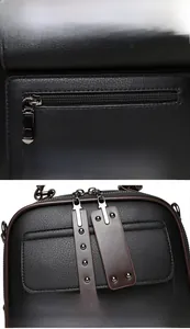 Detail of black pebbled leather handbag with metal zipper and brown studded leather puller