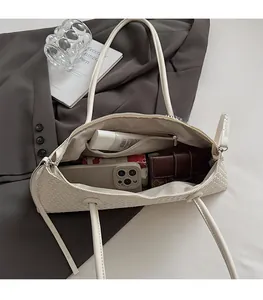 Detailed interior of woven leather tote bag showing large capacity for essentials