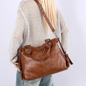 Brown vintage leather large capacity tote bag with adjustable shoulder strap and handles