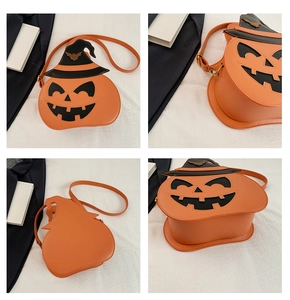 Detail shots of pumpkin crossbody bag with black wizard hat and gold bat accents