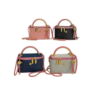 Elegant mini box bags in pink, black, denim blue and grey with chain straps and flower detail