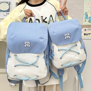 Light blue and beige canvas backpack in two sizes with trendy crisscross rope detail