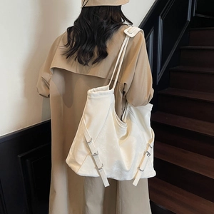 Chic white large capacity tote bag with metallic buckle detail for daily commute
