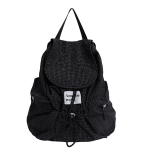 Minimalist black plaid drawstring backpack with lightweight canvas and side pockets