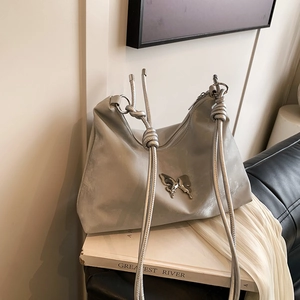 Women PU Leather Shoulder Bag Metal Butterfly Decoration Knotted Rope Strap Chic Minimalist Niche Design Hobo Tote Bag