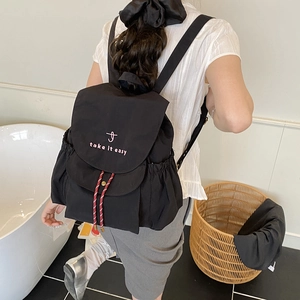 Minimalist black canvas drawstring backpack with pink embroidery and large capacity