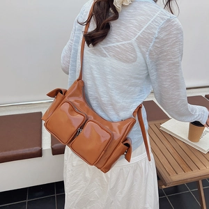 Vintage brown patent leather crossbody bag with multiple pockets and silver hardware