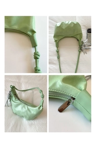 Detailed views of mint green dumpling bag featuring knot strap and star charms