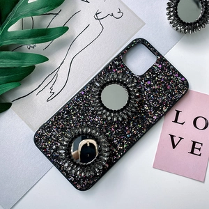 Close-up of luxury black glitter phone grip with dual sparkling rhinestone mirrors