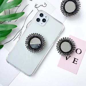 Detailed view of luxury rhinestone mirror phone socket on clear case with crystals