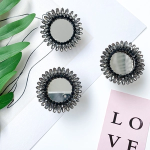 Detail of luxury rhinestone mirror phone socket with sunflower crystal design