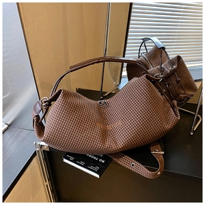 Detailed view of the brown plaid crossbody bag with luxury logo and sleek synthetic strap