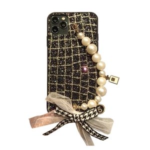 Luxury black glitter iPhone case with pearl bracelet and checkered ribbon bow