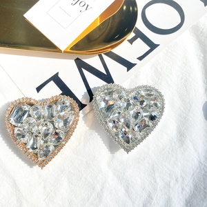 Luxury heart-shaped foldable phone grip with sparkling crystals in gold and silver finish