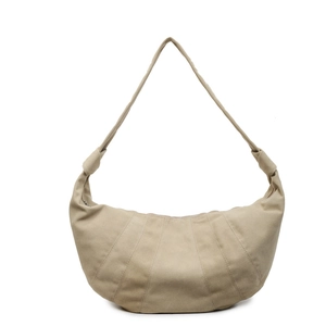 Minimalist beige canvas croissant shoulder bag with pleated design and wide strap