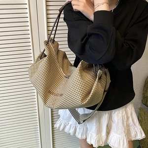 Classic checkered canvas hobo bag with adjustable brown shoulder strap for women