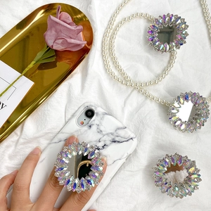 Luxury rhinestone folding mirror phone socket on white marble case with premium decor