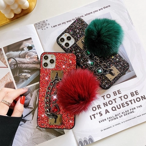 Glittery phone case for Samsung S20 with stylish fur pom-poms and jewel metal chains