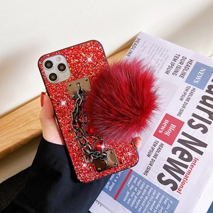 Sparkly red phone case with glitter sequins, metal heart chain and faux fur pom pom