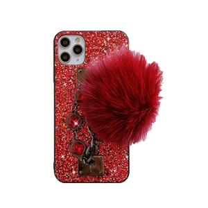 Sparkly red glitter phone case with rhinestone chain and fluffy pom-pom charm decoration
