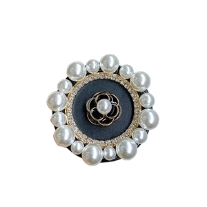 Black enamel camellia phone grip with white pearls and rhinestone accents