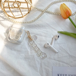Clear AirPods case with 3D butterfly, pearl accents and a stylish acrylic link chain