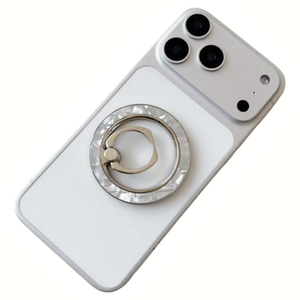 Magnetic MagSafe phone ring holder with white shell texture on a white smartphone