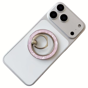 Detail of magnetic MagSafe phone ring holder with pink mother of pearl shell texture