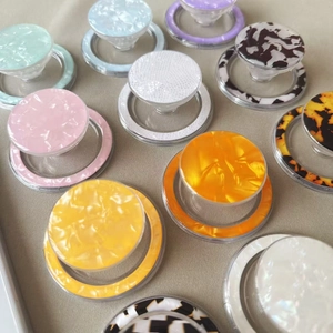 Magnetic shell pattern phone sockets in marble and amber textures for iPhone