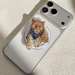 Magnetic leopard pattern phone grip stand on silver smartphone with natural lighting
