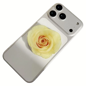 Detail of silver-grey phone case with yellow rose pattern and triple camera cutouts