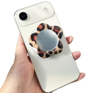 Magnetic flower leopard acrylic phone stand with mirror on a white smartphone