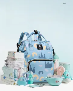 Detailed internal storage of light blue baby diaper bag with diapers and baby accessories