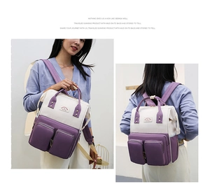 Front and back view of a large capacity purple and beige patchwork diaper backpack