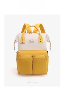 Close-up of yellow and white multi-pocket waterproof nylon backpack diaper bag details