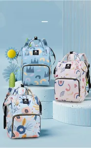 Three multi-functional diaper backpacks with various prints on blue display steps