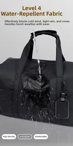 Macro shot showing high-density water-resistant fabric on black travel duffel bag
