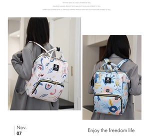 Detail of multi-functional diaper backpack with geometric and floral print patterns