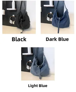 Three colors of oversized denim hobo bags with adjustable eyelet straps on dark background