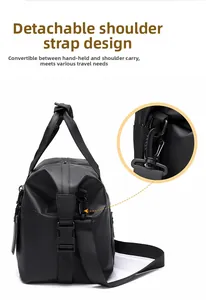 Detail of the detachable shoulder strap buckle on this large black travel bag