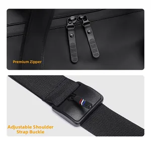 Detailed view of dual metal zippers and adjustable shoulder strap with tri-color accent