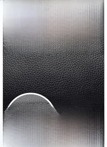 Detail of black oiled wax leather bag showing fine pebble texture and precise stitching