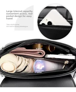 Internal view of black leather handbag showing large capacity and multi-layer compartments