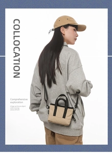 Detail of mini crossbody bag with detachable nylon strap and side carabiner hook