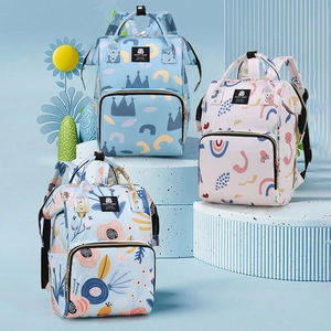 Multifunctional mommy backpacks in blue crown and floral prints on display stands
